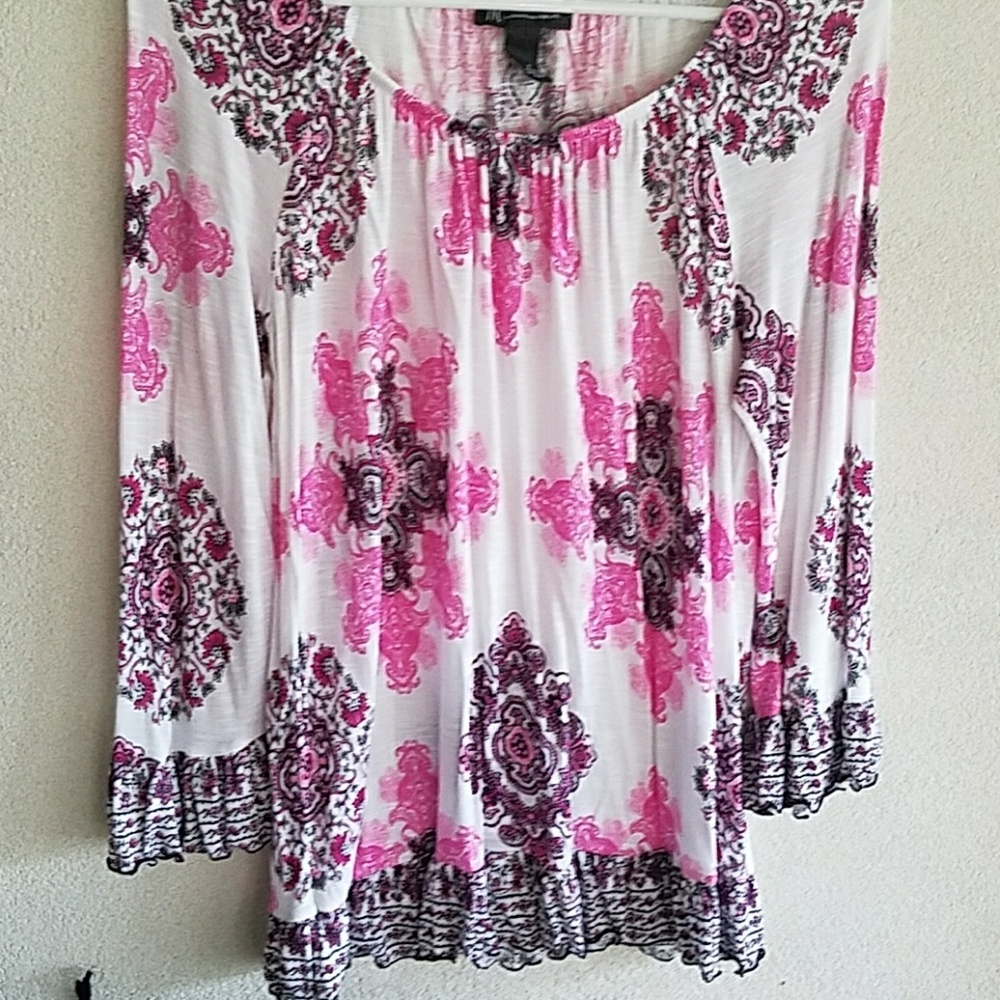 Donated Inc white, pink, and black patterned shirt